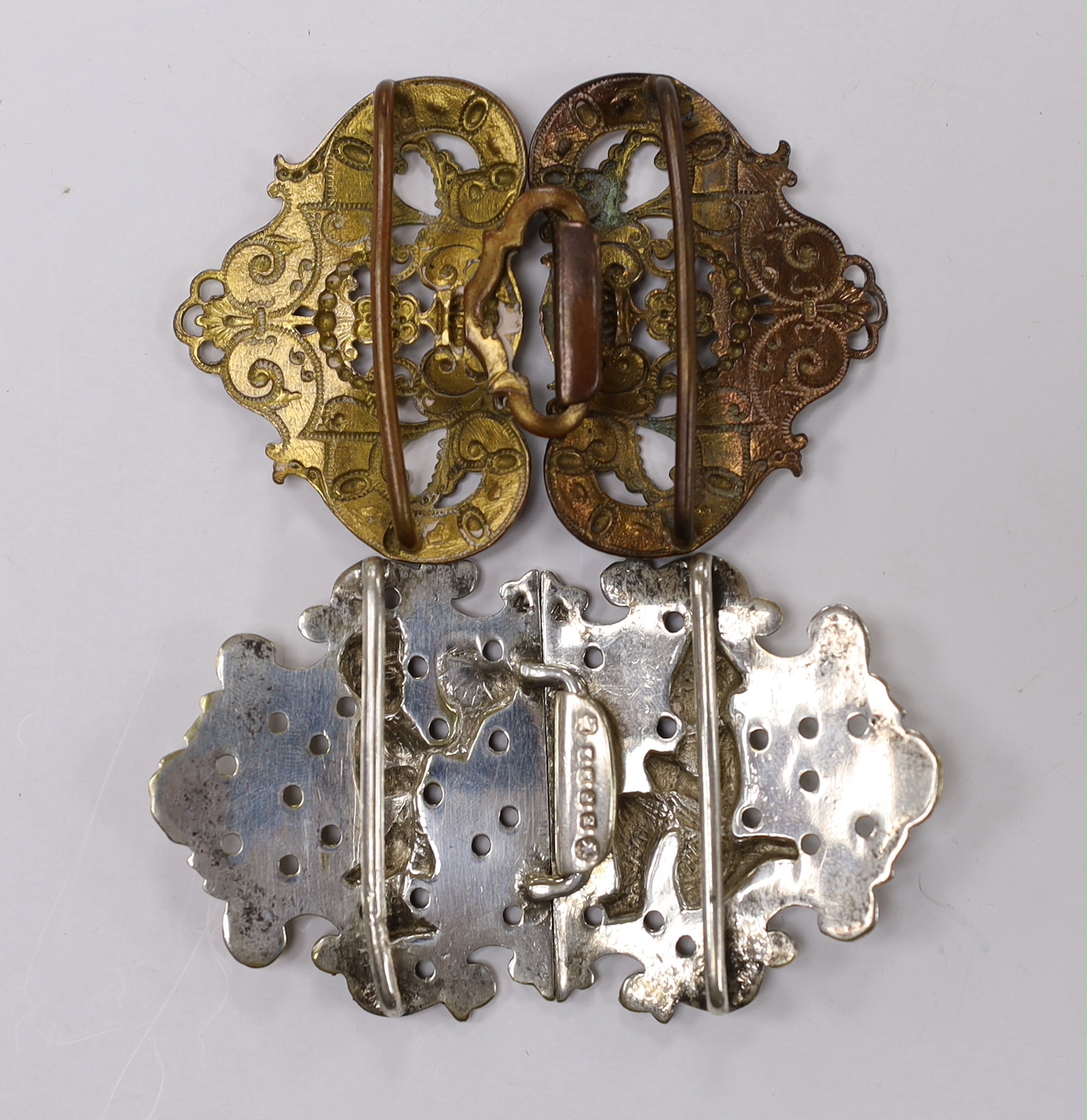 An Indian style silver plated belt buckle and another enamelled